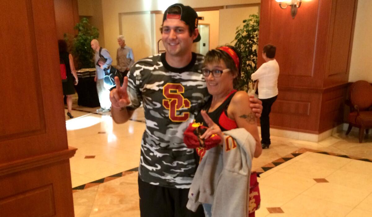 Stacy Leininger meets USC quarterback Cody Kessler in Salt Lake City.