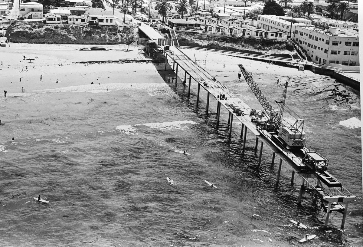 A crane sits atop the Ocean Beach Pier in 1965 during its construction.