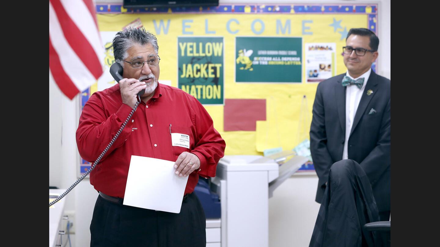 With school principal Oscar Macias at right, state Sen. Anthony Portantino read the morning's "Words of Wisdom" at Burbank Luther Middle School ion Tuesday. Portantino also visited two classrooms and spoke with students in the 7th and 8th grade ASB Leadership Class and a 7th grade social studies class.