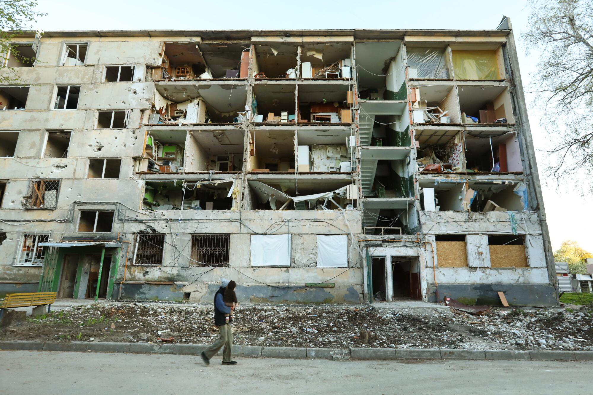 Close to the frontline, people continue to live in some of the heavily damaged neighborhoods in Kharkiv.