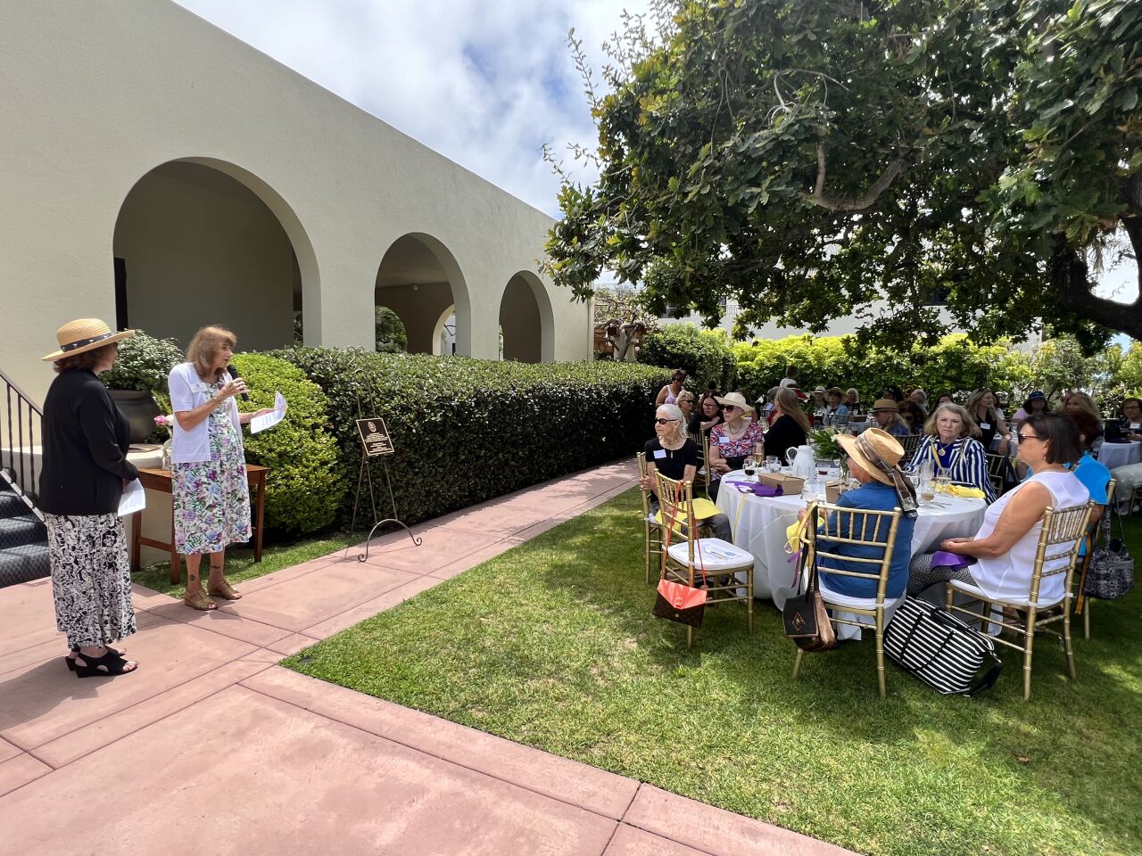 Carrie Beinert, vice president of the Crown Colony chapter of the National Society Colonial Dames XVII Century, addresses the La Jolla Woman's Club on Aug. 2.