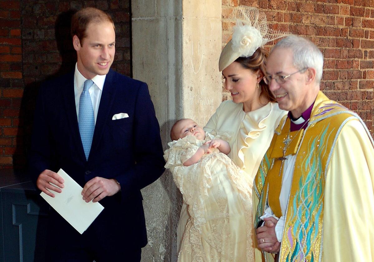 Britain's Prince William and his wife Catherine, duchess of Cambridge, leave with their son Prince George of Cambridge following his christening by the Archbishop of Canterbury, right, at Chapel Royal in St James's Palace in central London.
