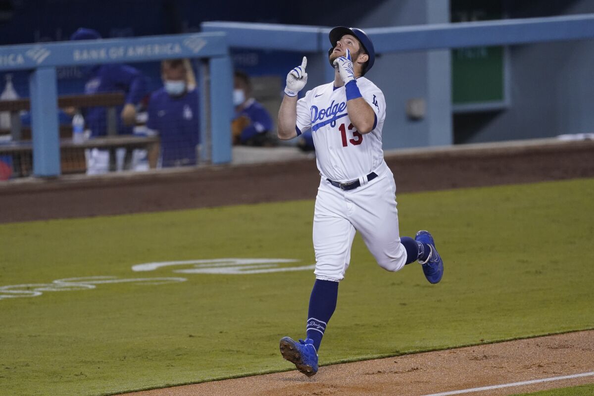 Dodgers first baseman Max Muncy celebrates after hitting a two-run home run against the Oakland Athletics.