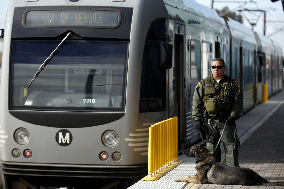 A sheriff's deputy on a Metro rail platform