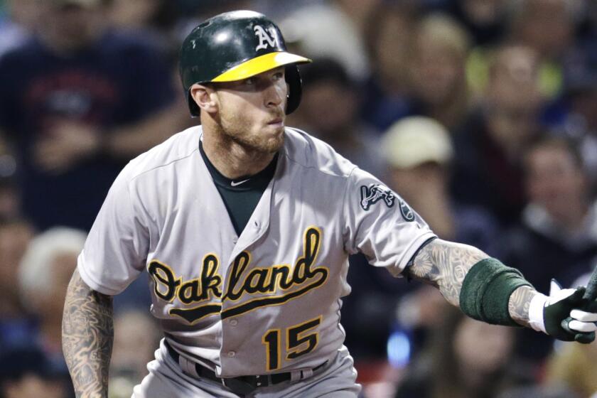 Oakland Atheltics third baseman Brett Lawrie waits for a pitch during a game against the Boston Red Sox at Fenway Park on June 5, 2015.