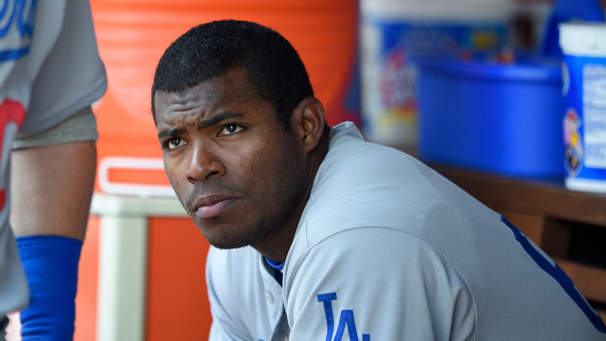 Dodgers' Yasiel Puig looks on from the dugout against Washington on July 21.