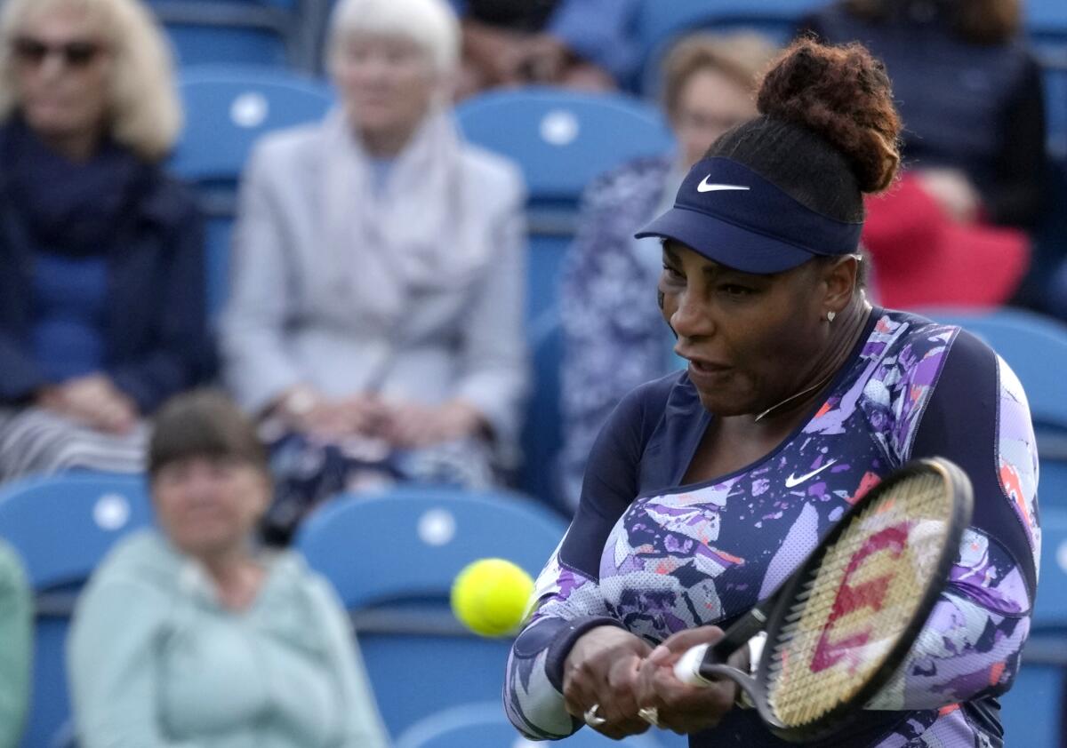 Serena Williams hits a return during her doubles match at Eastbourne on Tuesday.