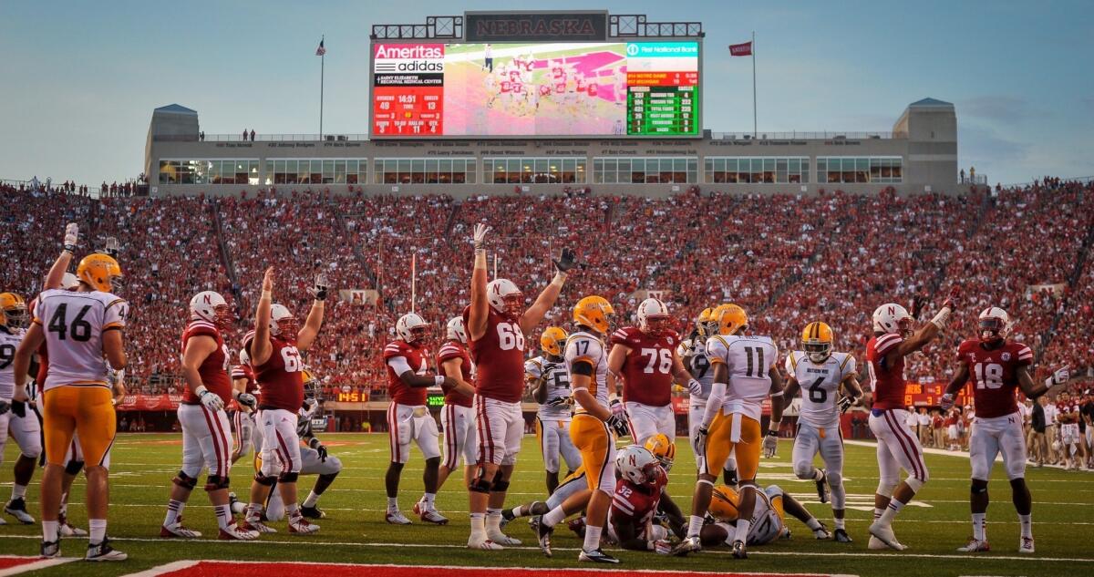 Nebraska players celebrate a touchdown during their win over Southern Mississippi last week. UCLA would be wise not to underestimate the Cornhuskers on their home turf.