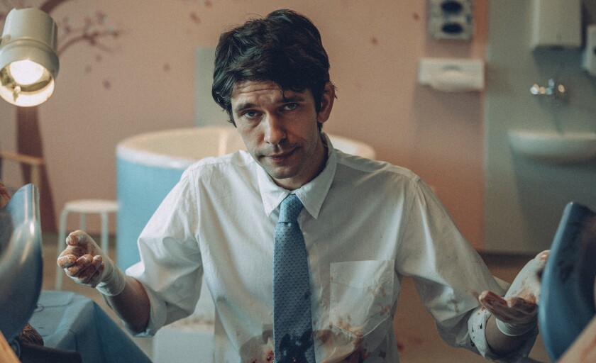 A man with bloody gloves and shirt