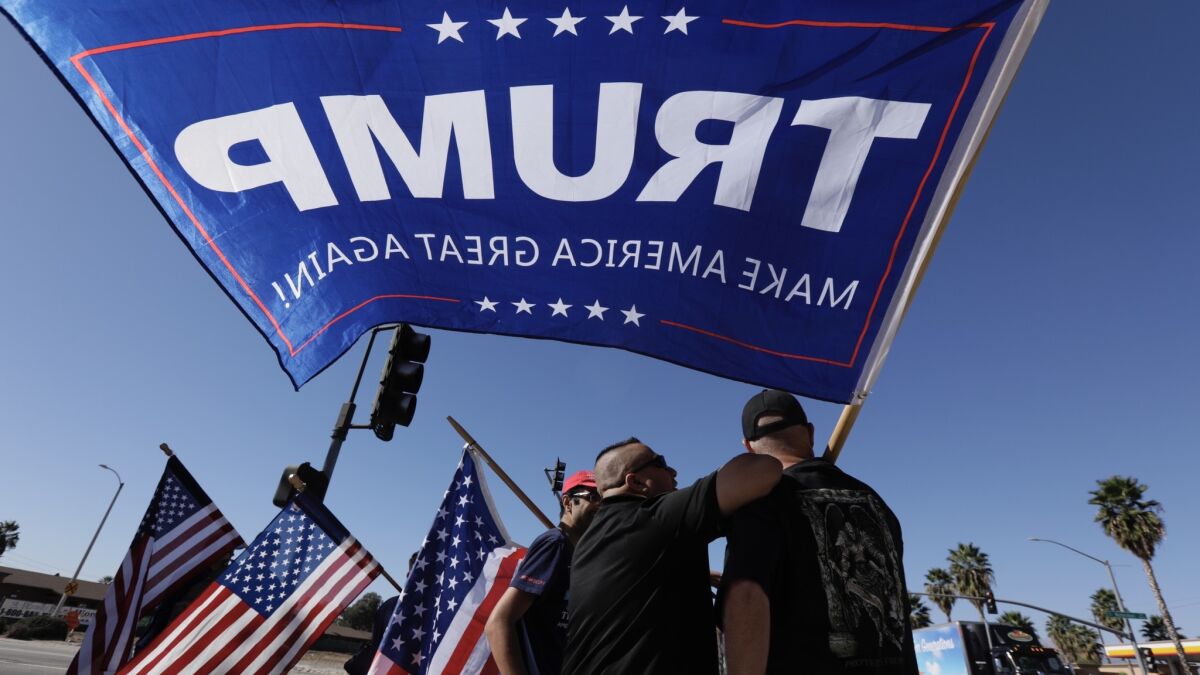 Anti-Sharia demonstrators wave Trump banners at the site of the 2015 San Bernardino attack.