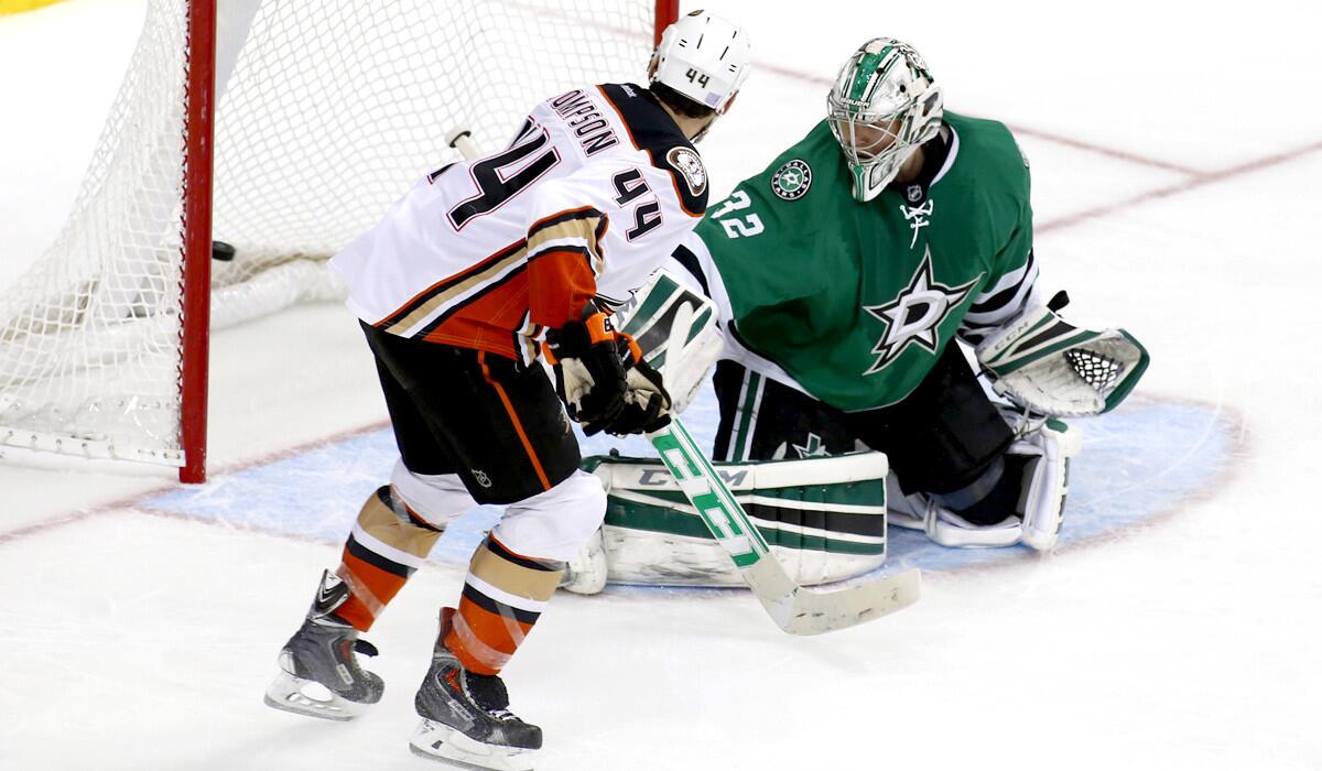 Ducks center Nate Thompson (44) tips a shot past Stars goalie Kari Lehtonen for the winning goal in overtime Friday night in Dallas.