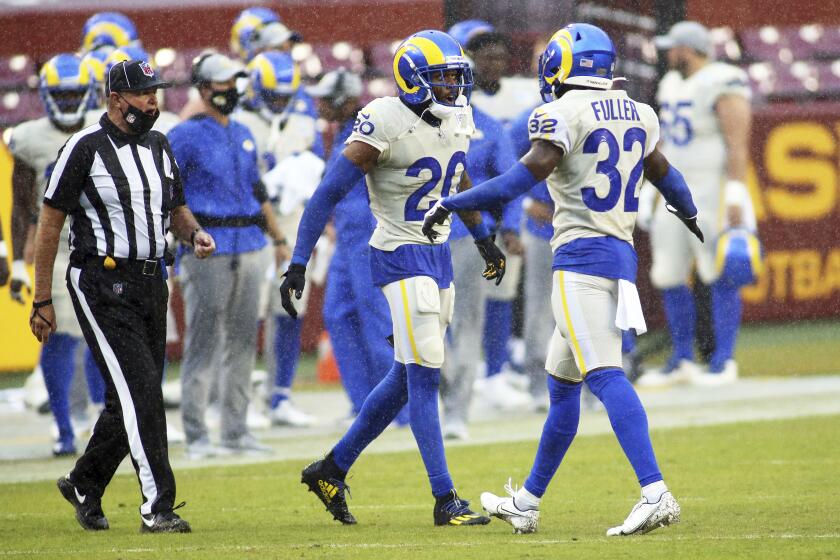 Los Angeles Rams cornerback Jalen Ramsey (20) and Los Angeles Rams strong safety Jordan Fuller (32) celebrate during an NFL football game against the Washington Football Team, Sunday, Oct. 11, 2020 in Landover, Md. (AP Photo/Daniel Kucin Jr.)