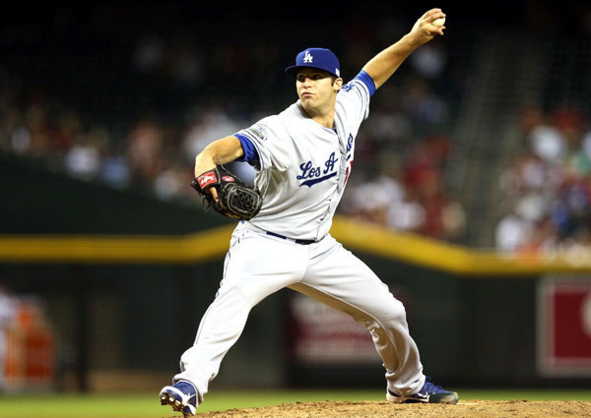 Reliever Paco Rodriguez works against the Diamondbacks during a game in Phoenix.