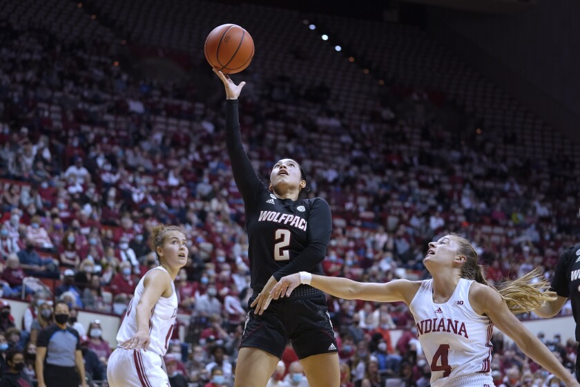 North Carolina State's Raina Perez (2) shoots next to Indiana's Nicole Cardano-Hillary (4) during the first half of an NCAA college basketball game Thursday, Dec. 2, 2021, in Bloomington, Ind. (Darron Cummings)