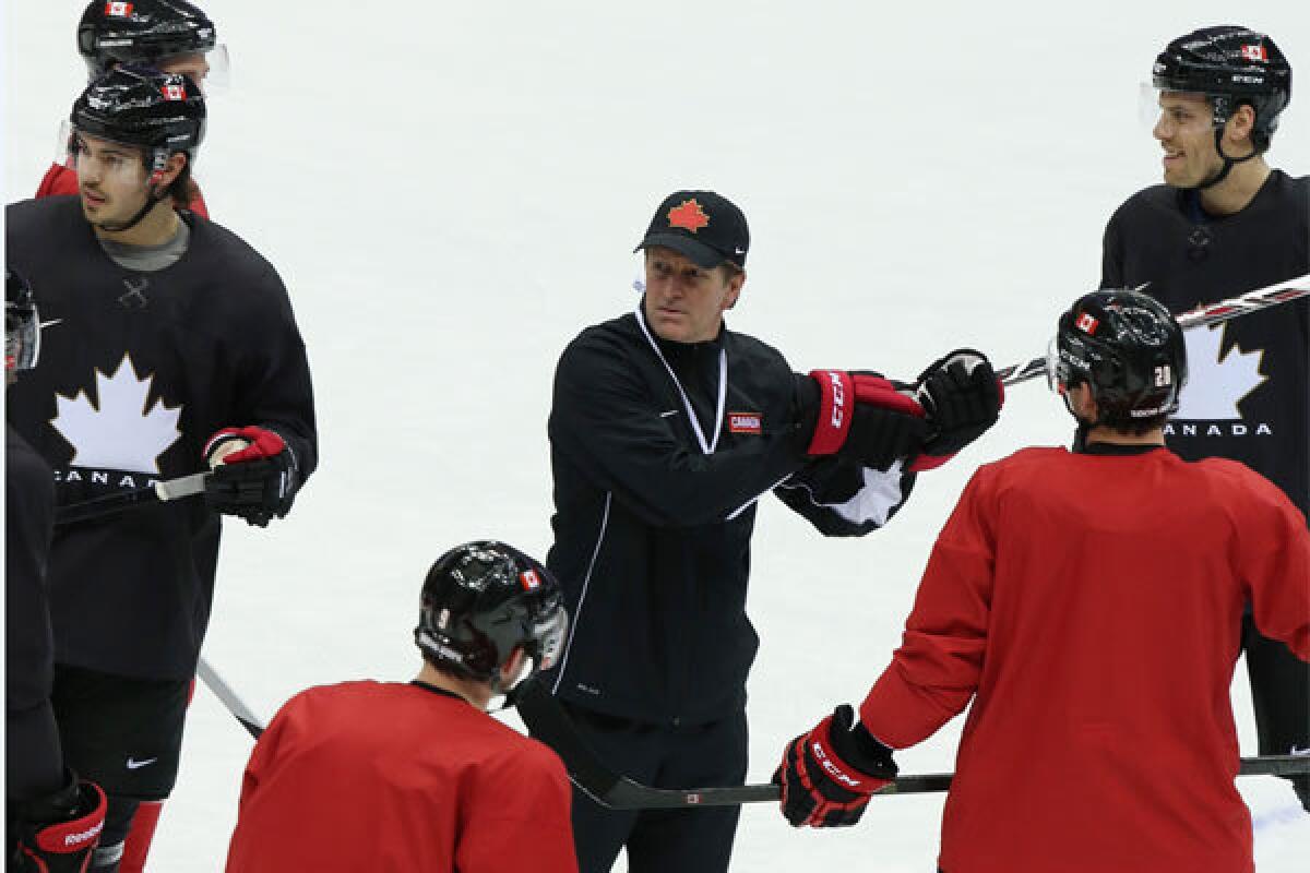 Canada Coach Mike Babcock conducts practice Monday at the Sochi 2014 Winter Olympics at Bolshoy Arena.