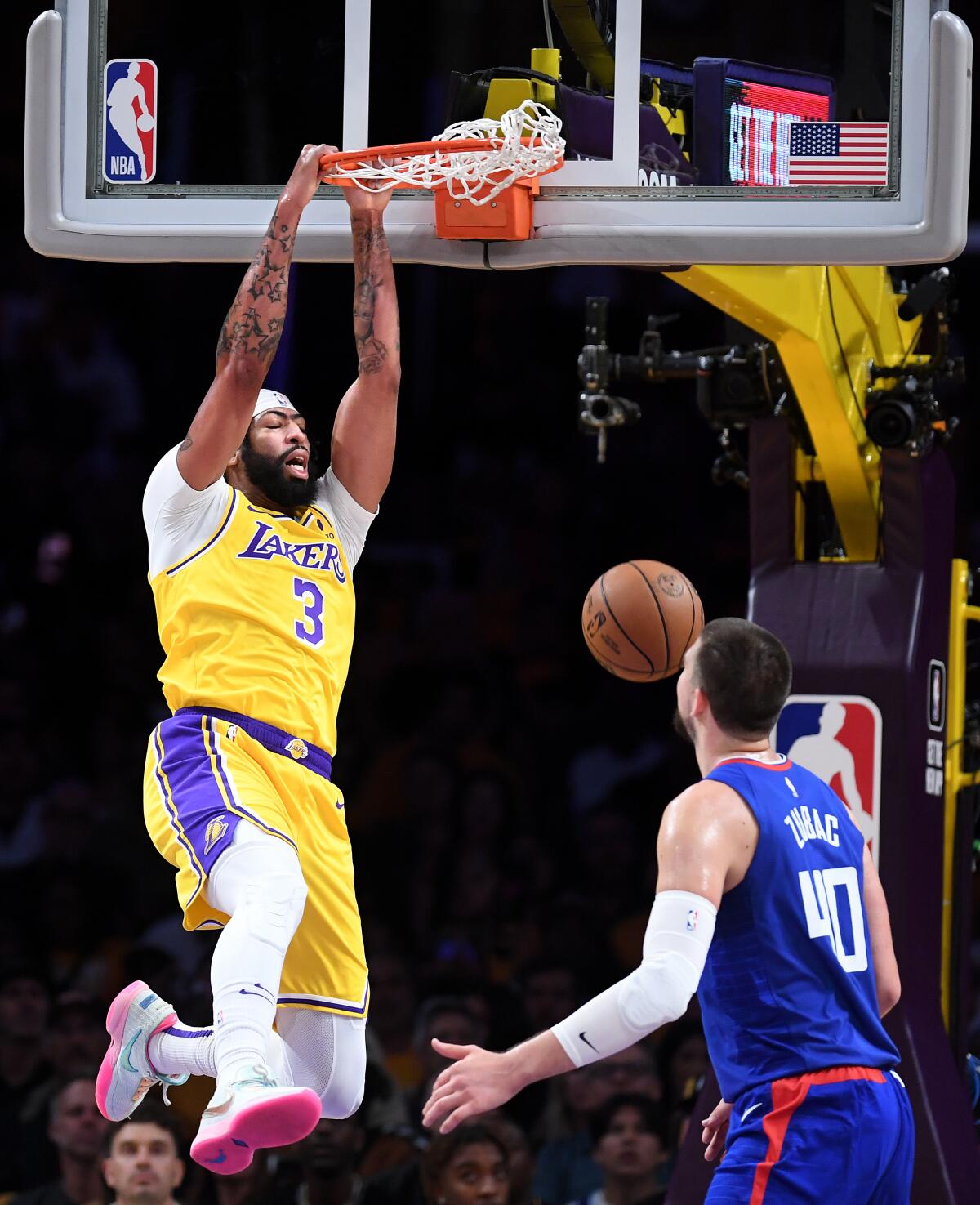 Lakers forward Anthony Davis dunks in front of Clippers center Ivica Zubac in the first quarter Thursday.