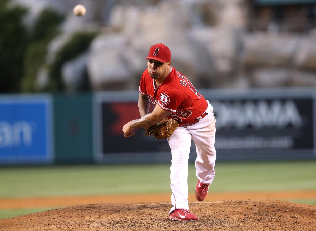 Angels starter Hector Santiago gave up four runs and five hits in five innings Saturday night against Texas.