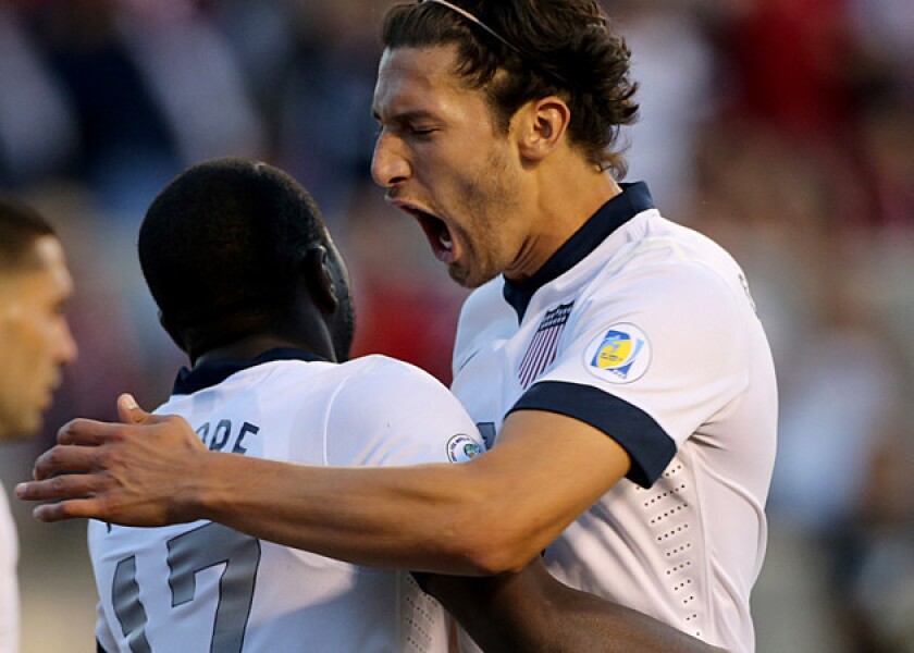 U.S. soccer national team's Omar Gonzalez, right, celebrates with Jozy Altidore after Altidore's goal against Honduras during a World Cup qualifying match.