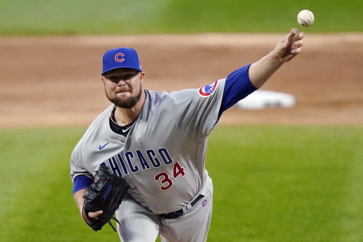 FILE - In this Sept. 26, 2020, file photo, Chicago Cubs starting pitcher Jon Lester throws to a Chicago White Sox batter during the first inning of a baseball game in Chicago. Washington Nationals manager Dave Martinez said Lester, who signed with the team in January, has been playing catch on flat ground and soon should be able to throw off a mound again to work his way into form for the regular season, which begins April 1. The Nationals left-hander had surgery to remove a thyroid gland. (AP Photo/Nam Y. Huh, File)