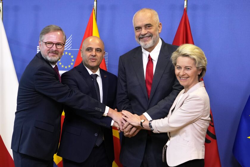 FILE - From right, European Commission President Ursula von der Leyen, Albanian Prime Minister Edi Rama, North Macedonia's Prime Minister Dimitar Kovacevski and Czech Republic's Prime Minister Petr Fiala shake hands prior to a meeting at EU headquarters in Brussels, on July 19, 2022. The war in Ukraine has put the European Union's expansion at the top of the agenda as officials from the Western Balkans and EU leaders gather Tuesday for a summit intended to reinvigorate the whole enlargement process. (AP Photo/Virginia Mayo, File)