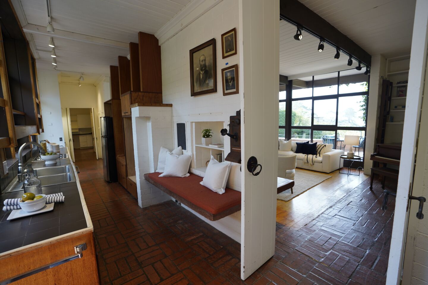 San Diego, California - December 02: The historic home of oceanographer Walter Munk. The kitchen area looking towards the living room at La Jolla Shores on Thursday, Dec. 2, 2021 in San Diego, California. (Alejandro Tamayo / The San Diego Union-Tribune)
