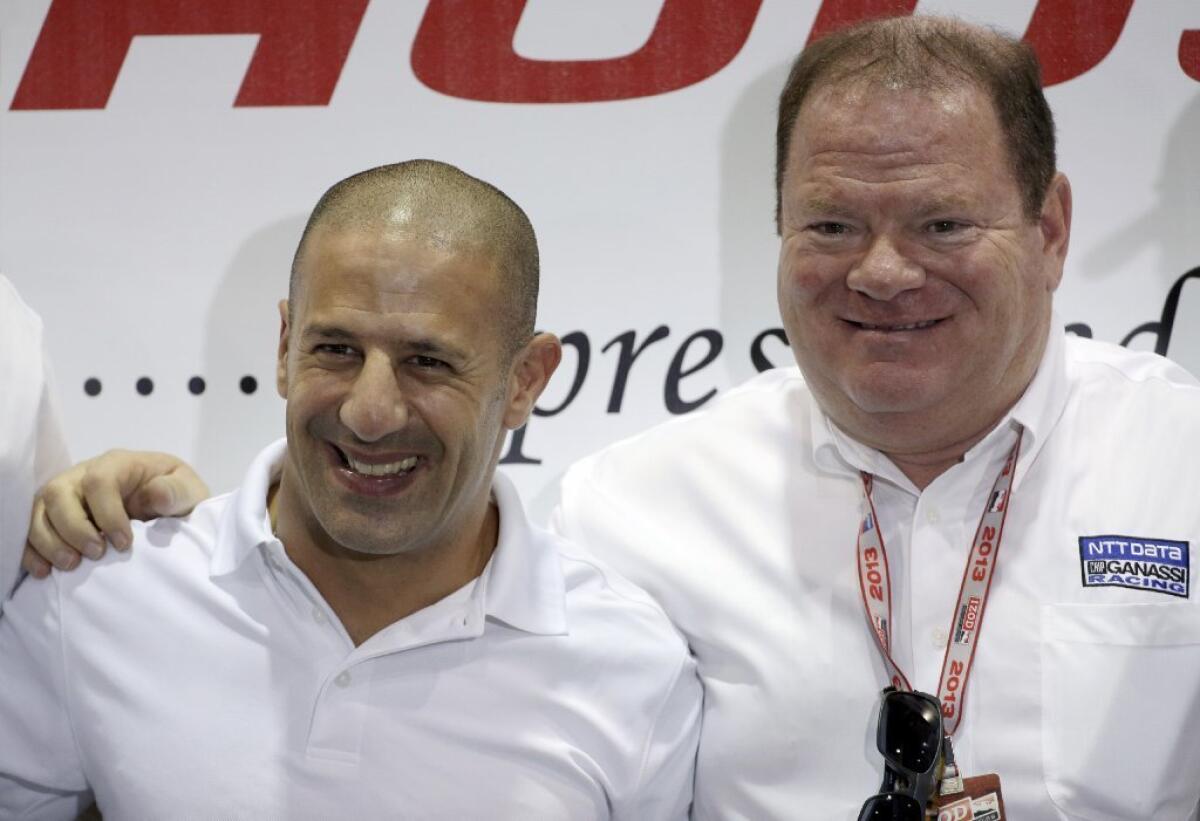 Chip Ganassi, right, with driver Tony Kanaan at a news conference on Friday.