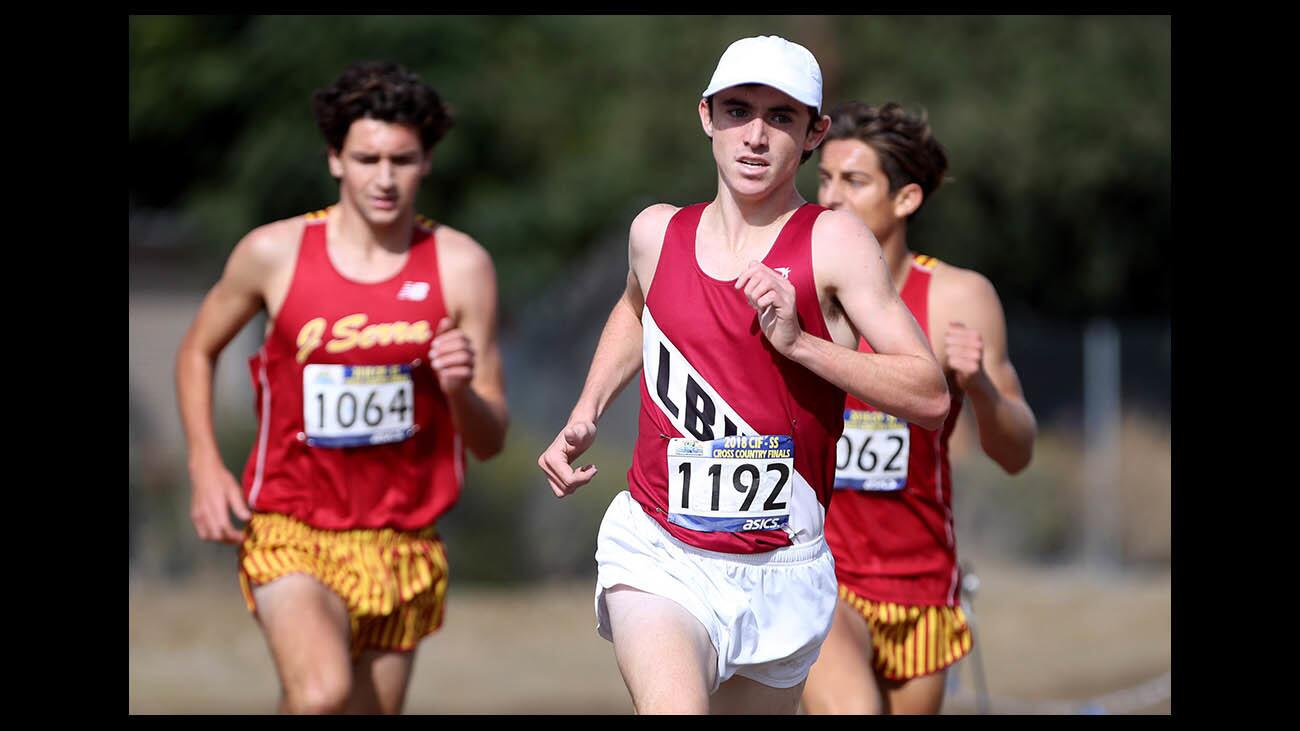 Laguna Beach High School runner Ryan Smithers overtook two J. Serra runners to win the boys' Division 4 race in the CIF Southern Section cross country finals, at Riverside City Cross Country Course in Riverside on Saturday, Nov. 17, 2018.
