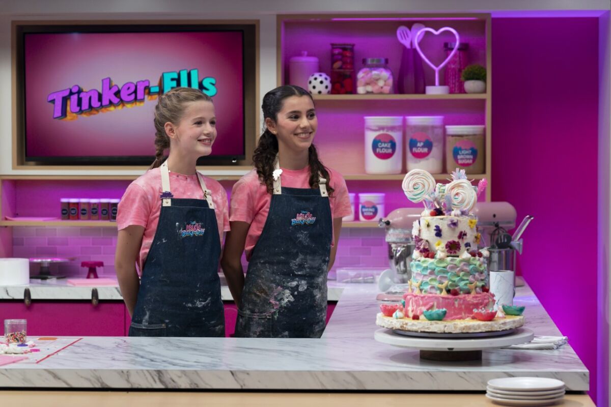 From left, Ellie Joyce, 11, and Ella Traverso, 13 on the set of "Disney's Magic Bake-Off."
