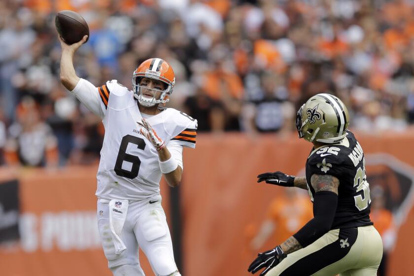 Cleveland Browns quarterback Brian Hoyer throws under pressure from New Orleans Saints strong safety Kenny Vaccaro.