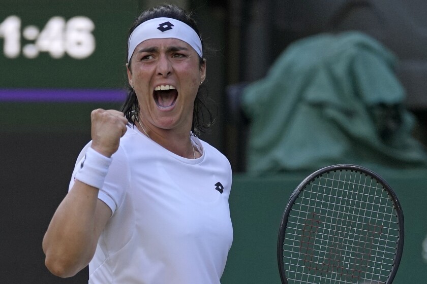 Tunisia's Ons Jabeur celebrates after winning a point against Marie Bouzkova of the Czech Republic in a women's singles quarterfinal match on day nine of the Wimbledon tennis championships in London, Tuesday, July 5, 2022. (AP Photo/Alastair Grant)