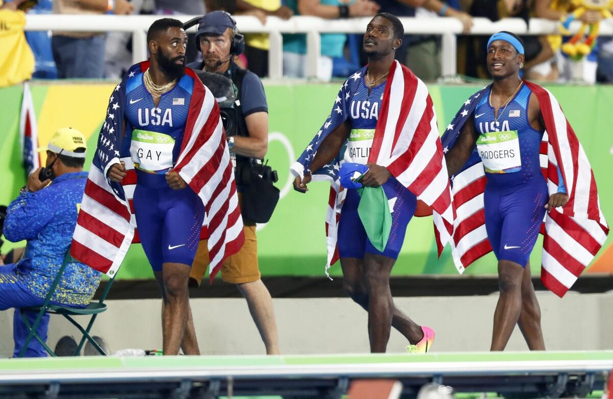 Tyson Gay, Justin Gatlin and Mike Rodgers of the U.S. 400-meter relay team.