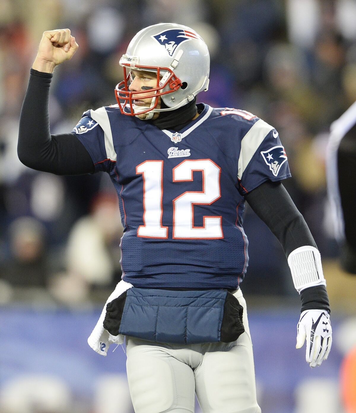 New England quarterback Tom Brady celebrates a touchdown during the Patriots' 34-31 comeback victory over the Denver Broncos at Gillette Stadium in Foxborough, Mass.