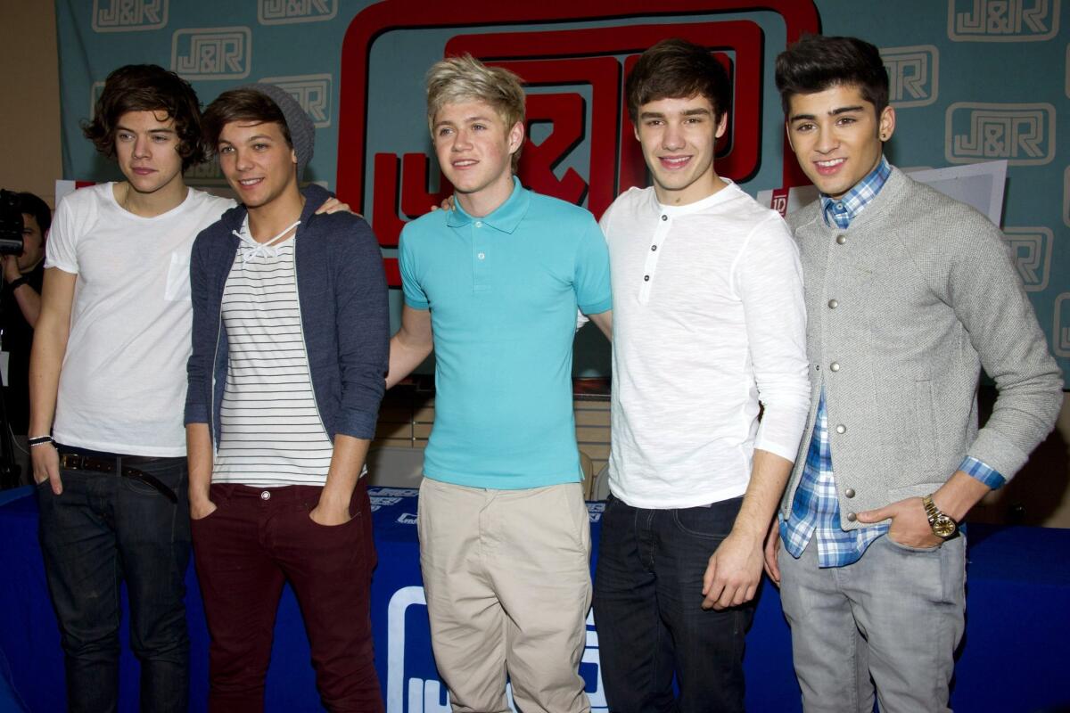One Direction members at a record signing in March 2012: Harry Styles, left, Louis Tomlinson, Niall Horan, Liam Payne and Zayn Malik.