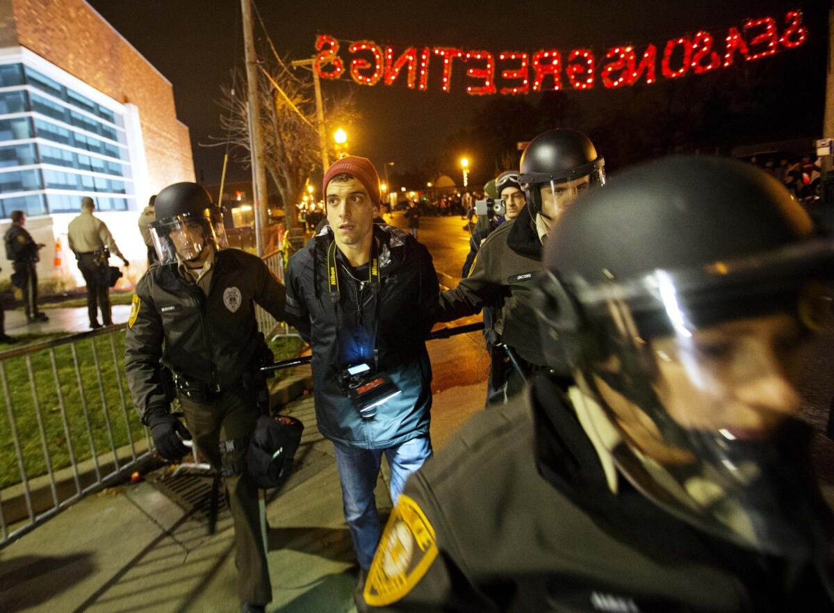 Journalist Trey Yingst is arrested during a demonstration outside police headquarters in Ferguson, Mo.