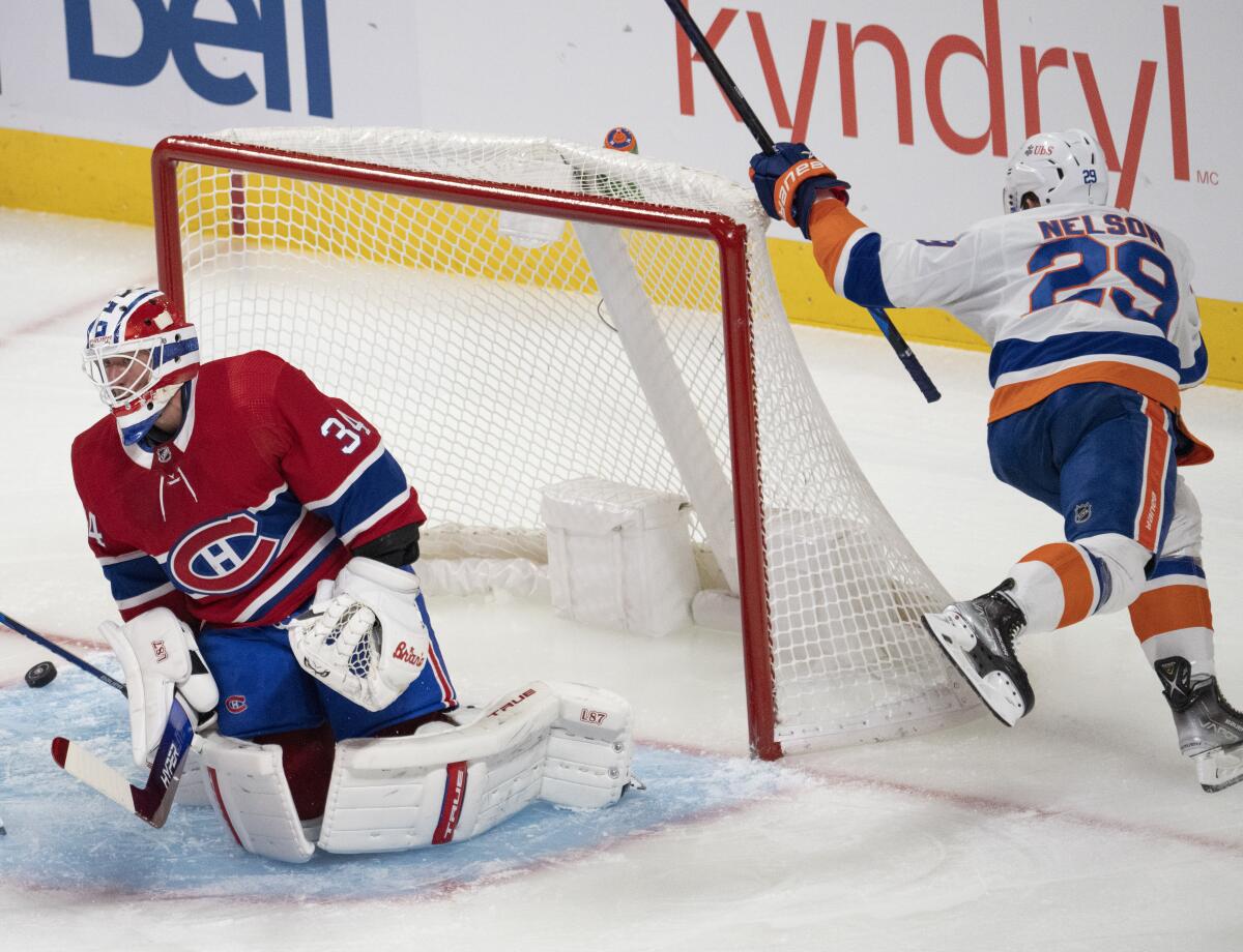 New York Islanders' Brock Nelson (29) scores on Montreal Canadiens goaltender Jake Allen (34) during the first period of an NHL hockey game Thursday, Nov. 4, 2021, in Montreal. (Ryan Remiorz/The Canadian Press via AP)