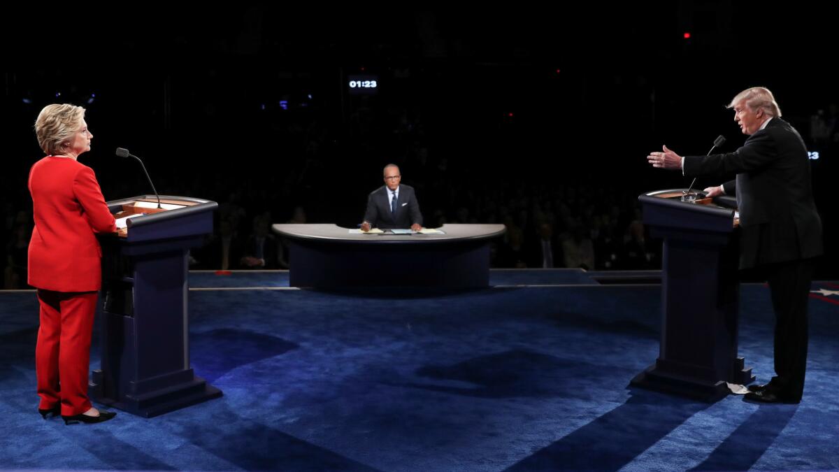 Republican presidential nominee Donald Trump gestures toward Democratic presidential nominee Hillary Clinton during the presidential debate at Hofstra University in Hempstead, N.Y., on Sept. 26.