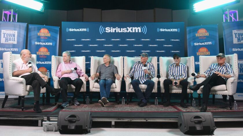 A SiriusXM town hall gathered Beach Boys members, Brian Wilson, second from left and continuing right: Al Jardine, Mike Love, David Marks and Bruce Johnston. The event was moderated by Rob Reiner, left.