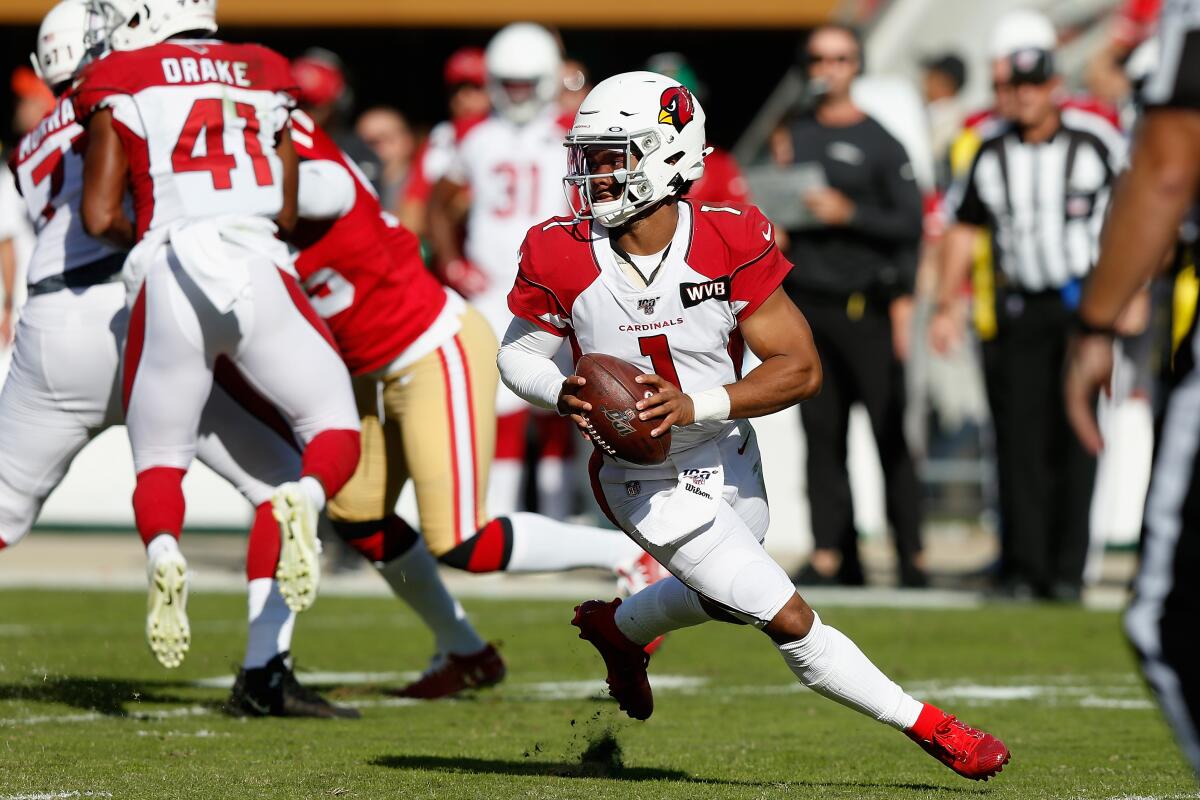 Arizona Cardinals quarterback Kyler Murray looks to pass.