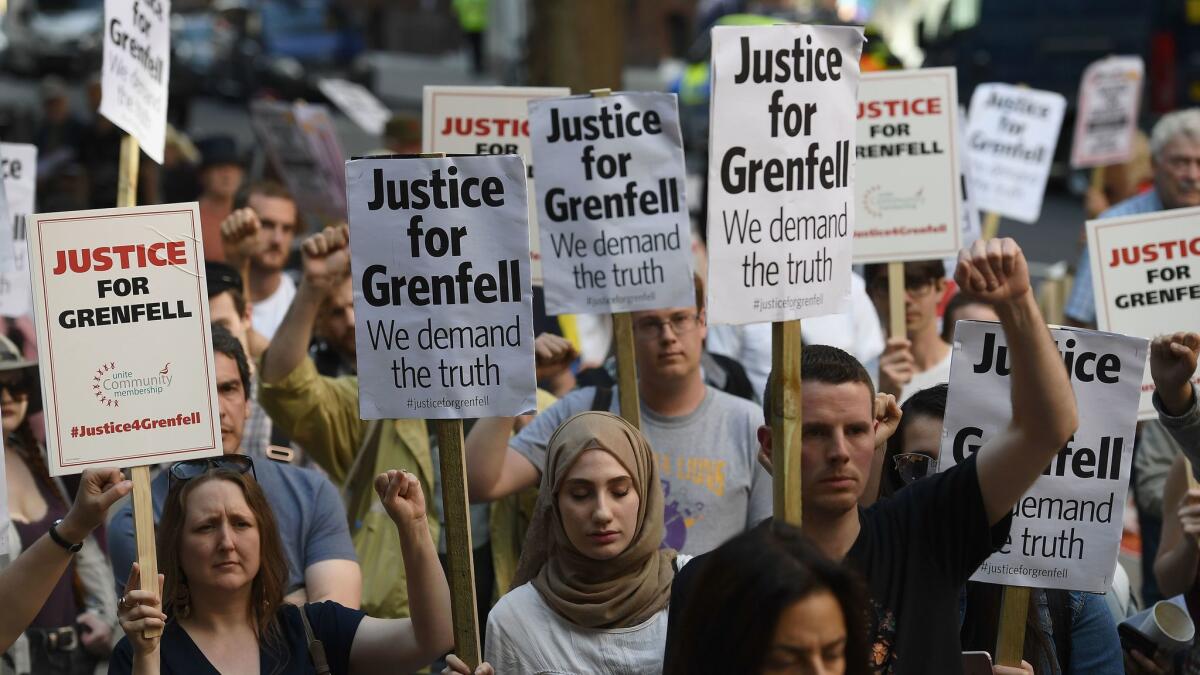 A rally June 16 calls for justice for those affected by the Grenfell Tower fire in London.