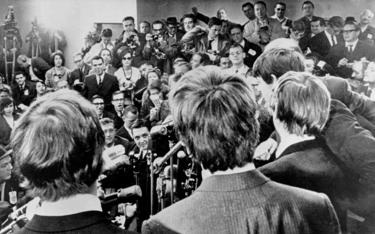 The Beatles face the media at JFK Airport after their arrival in America on Feb. 7, 1964. The band's early years will be the focus of a forthcoming Ron Howard-directed documentary called "The Beatles: Eight Days a Week - the Touring Years."