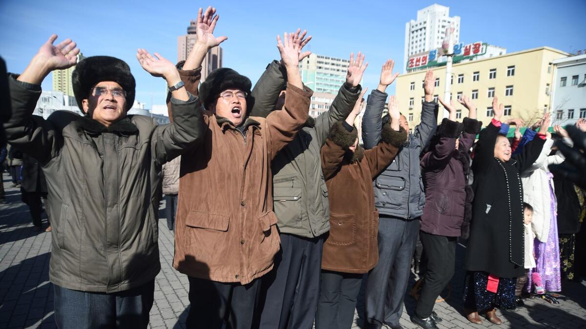 TOPSHOT - Pyongyang residents react at the Pyongyang Railway Station after the news of the successful launch of the new intercontinental ballistic missile (ICBM) Hwasong-15 in Pyongyang on November 29, 2017. North Korean leader Kim Jong Un said on November 29 his country had achieved full nuclear statehood after successfully testing a new missile capable of hitting anywhere in the United States. / AFP PHOTO / Kim Won-JinKIM WON-JIN/AFP/Getty Images ** OUTS - ELSENT, FPG, CM - OUTS * NM, PH, VA if sourced by CT, LA or MoD **