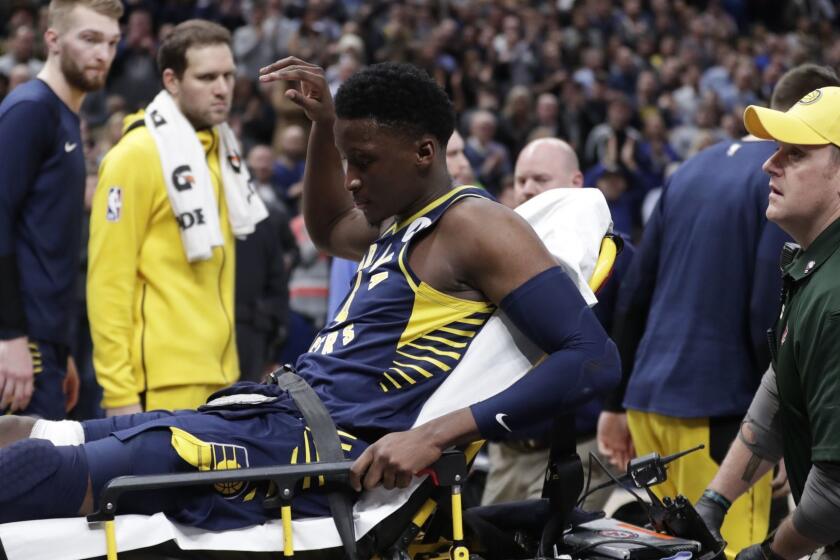 Indiana Pacers guard Victor Oladipo is taken off the court on a stretcher after he was injured during the first half of the team's NBA basketball game against the Toronto Raptors in Indianapolis, Wednesday, Jan. 23, 2019. (AP Photo/Michael Conroy)