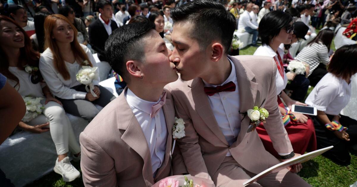 Hundreds of same-sex couples marry in Taiwan on first day it's