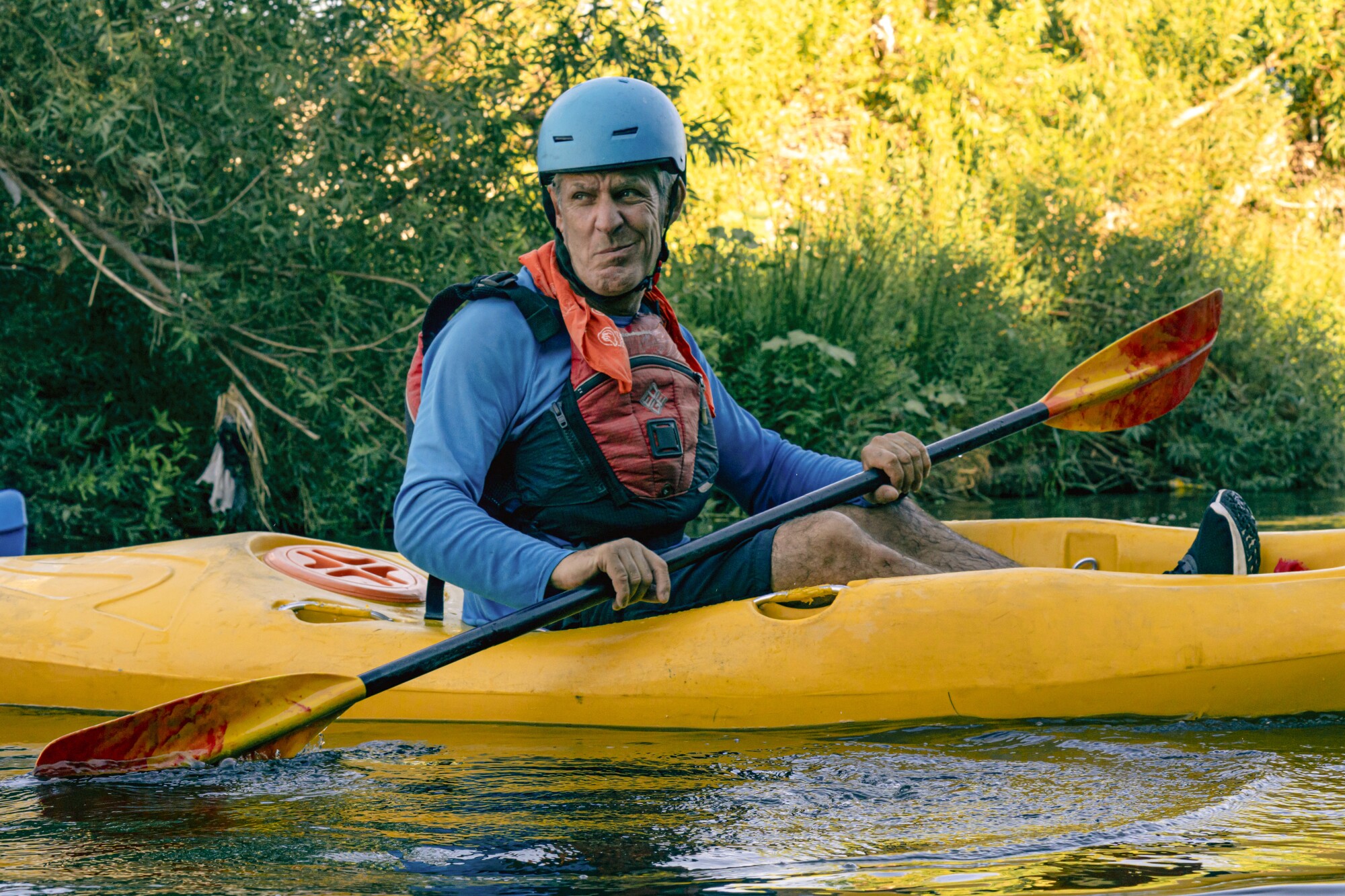 A man sits in a kayak.