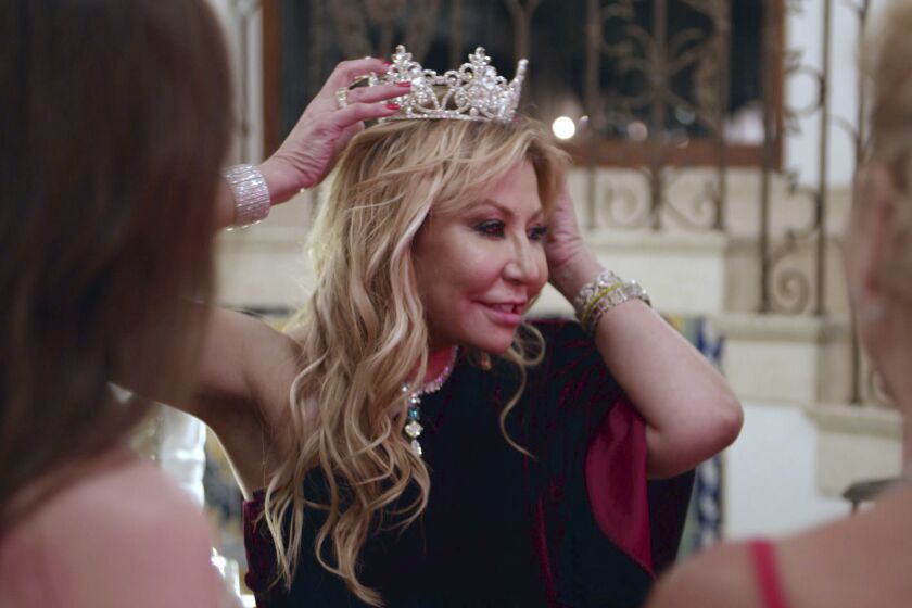 This image released by Netflix shows Anna Shay in a scene from the series "Bling Empire." Shay, an heiress, philanthropist and breakout star of the Netflix reality series “Bling Empire,” died from a stroke, according to a family statement provided to The Associated Press on Monday. She was 62. (Netflix via AP)