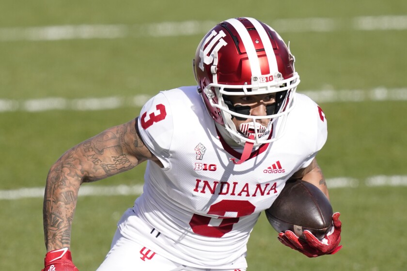 FILE — In this Nov. 14, 2020, file photo, Indiana wide receiver Ty Fryfogle plays during the first half of an NCAA college football game, in East Lansing, Mich. Fryfogle is returning for his fifth season this fall. (AP Photo/Carlos Osorio, File)
