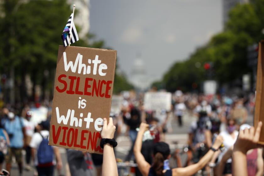 Demonstrators protest, Saturday, June 6, 2020, in Washington, over the death of George Floyd, a black man who was in police custody in Minneapolis. Floyd died after being restrained by Minneapolis police officers. (AP Photo/Andrew Harnik)