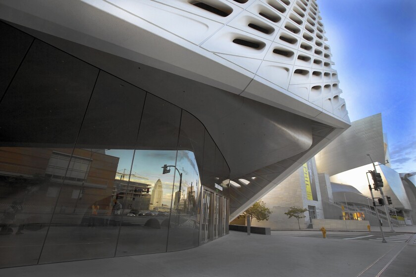 A wall of glass peeks out from under the Broad museum’s honeycomb facade, a striking element on a stretch of Grand Avenue that also features Disney Hall.