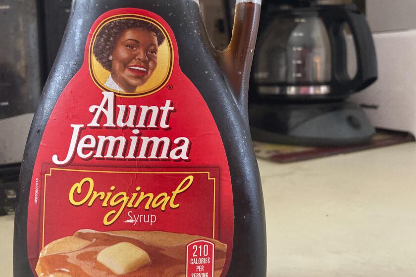A bottle of Aunt Jemima syrup sits on a counter, Wednesday, June 17, 2020 in White Plains, N.Y. Pepsico is changing the name and marketing image of its Aunt Jemima pancake mix and syrup, according to media reports. A spokeswoman for Pepsico-owned Quaker Oats Company told AdWeek that it recognized Aunt Jemima’s origins are based on a racial stereotype and that the 131-year-old name and image would be replaced on products and advertising by the fourth quarter of 2020. (AP Photo/Donald King)