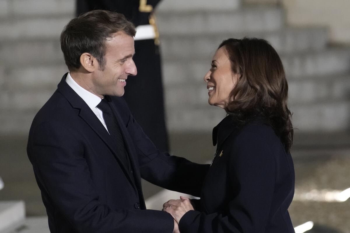 French President Emmanuel Macron welcomes Vice President Kamala Harris